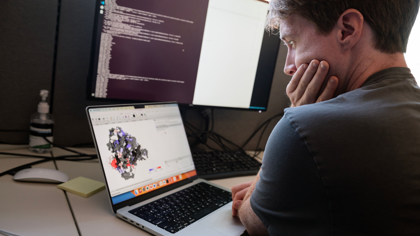 Carl Ward working at a computer at Gladstone Institutes