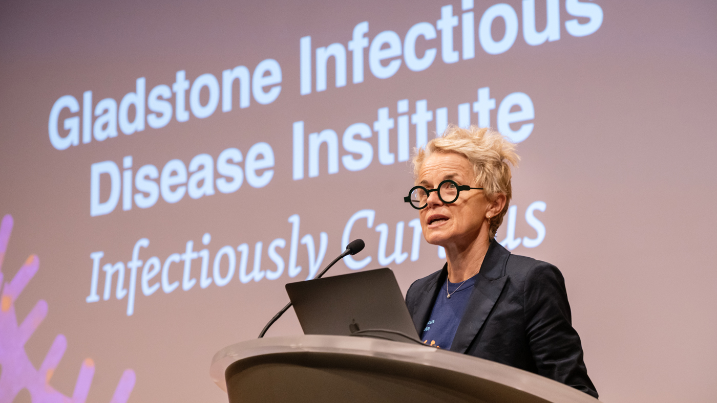 Melanie Ott speaking in the auditorium at Gladstone Institutes