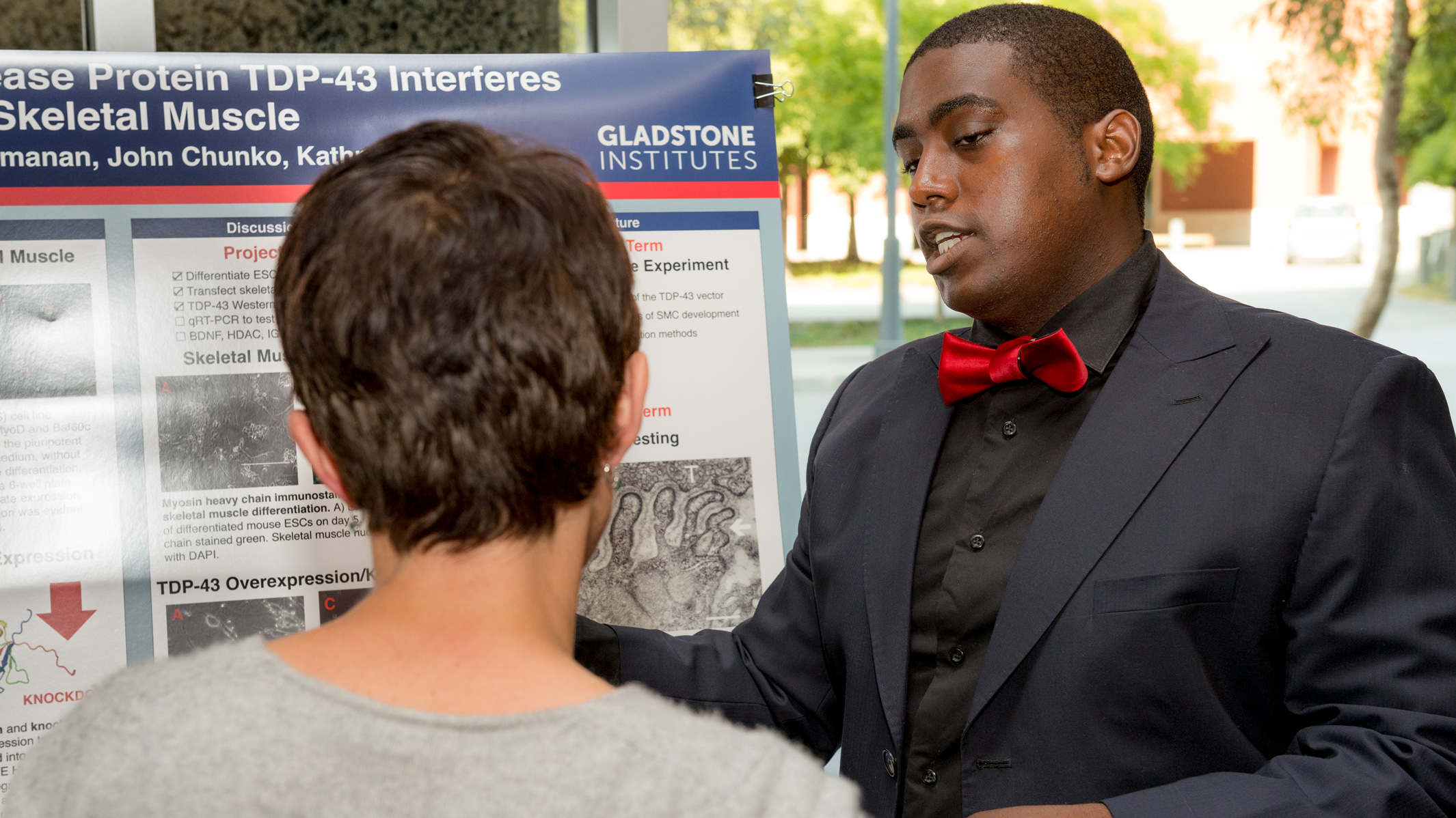 PUMAS intern Damon Williams presenting a poster during his internship