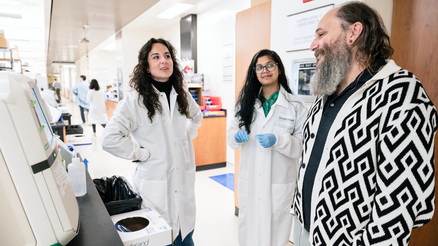 Scientists Kate Crawford, Darshini Poola, and Seth Shipman in the lab at Gladstone Institutes