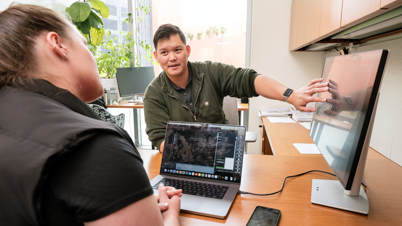 Andrew Yang speaking with Madigan Reid in his office at Gladstone Institutes