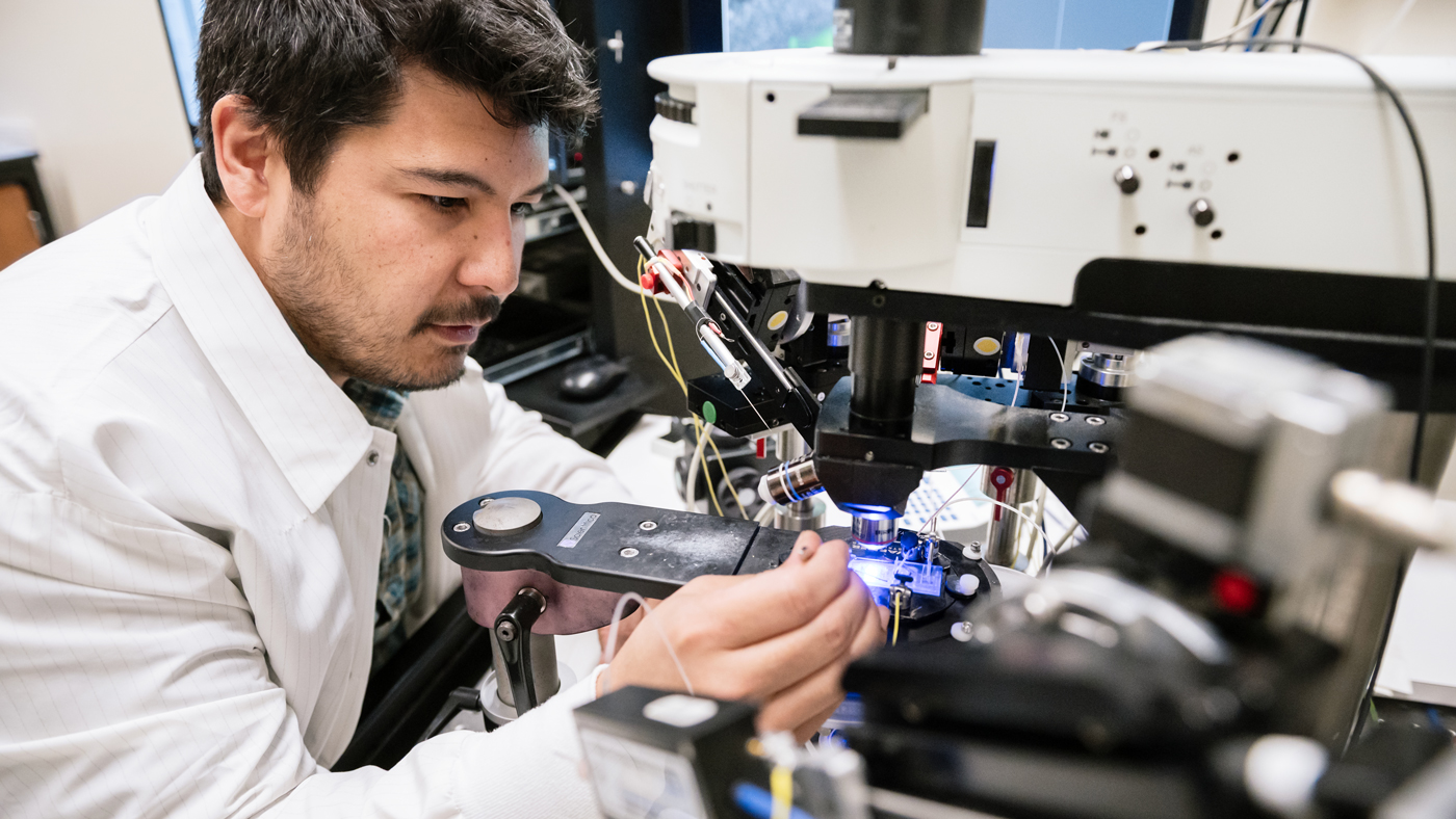 Scientist at a microscope