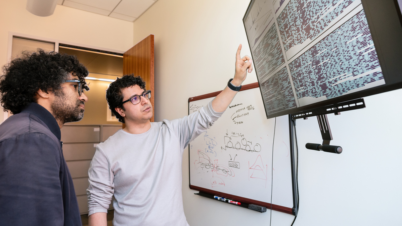 Vijay Ramani and Hani Goodarzi in an office at Gladstone Institutes