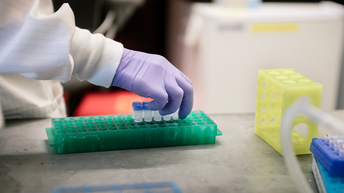 Close up of hands working with test tubes in the lab